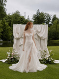 Load image into Gallery viewer, White Asymmetrical Bridal Gown with Floral Shoulder, Sculpted Bodice, Front Slit and Flowing Floor Length Skirt
