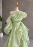 Load image into Gallery viewer, Light Green Asymmetrical Ruffle Statement Gown with Sculptural Neckline, Dramatic Sleeve and Cascading Side Detail