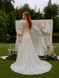 Load image into Gallery viewer, White Asymmetrical Bridal Gown with Floral Shoulder, Sculpted Bodice, Front Slit and Flowing Floor Length Skirt