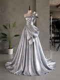 Load image into Gallery viewer, Silver One Shoulder Gown with Oversized Bow Detail, Sculptural Formal Dress, Made to Measure