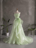 Load image into Gallery viewer, Light Green Strapless Formal Gown with Draped Bodice, Floral Waist Detail and Asymmetrical Flowing Skirt
