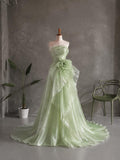 Load image into Gallery viewer, Light Green Strapless Formal Gown with Draped Bodice, Floral Waist Detail and Asymmetrical Flowing Skirt