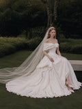 Load image into Gallery viewer, Ivory Statement Wedding Dress with Flowing Skirt and Refined Bridal Silhouette