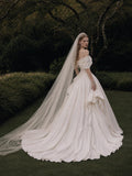 Load image into Gallery viewer, Ivory Statement Wedding Dress with Flowing Skirt and Refined Bridal Silhouette