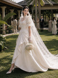 Load image into Gallery viewer, Ivory Statement Wedding Dress with Flowing Skirt and Refined Bridal Silhouette