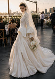 Load image into Gallery viewer, Ivory Statement Wedding Dress with Flowing Skirt and Refined Bridal Silhouette