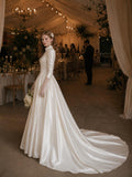 Load image into Gallery viewer, Ivory Statement Wedding Dress with Flowing Skirt and Refined Bridal Silhouette
