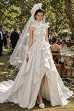 Load image into Gallery viewer, Ivory Statement Wedding Dress with Flowing Skirt and Refined Bridal Silhouette