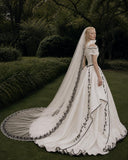 Load image into Gallery viewer, Ivory Wedding Gown with Graceful Full Length Silhouette and Dramatic Bridal Train