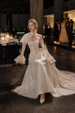 Load image into Gallery viewer, Ivory Wedding Gown with Graceful Full Length Silhouette and Dramatic Bridal Train