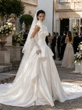 Load image into Gallery viewer, Ivory Statement Wedding Dress with Flowing Skirt and Refined Bridal Silhouette