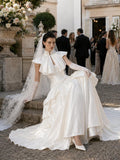 Load image into Gallery viewer, Ivory Statement Wedding Dress with Flowing Skirt and Refined Bridal Silhouette