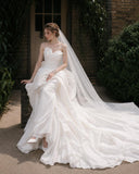 Load image into Gallery viewer, Ivory Wedding Gown with Graceful Full Length Silhouette and Dramatic Bridal Train