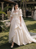 Load image into Gallery viewer, Ivory Statement Wedding Dress with Flowing Skirt and Refined Bridal Silhouette