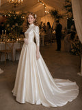 Load image into Gallery viewer, Ivory Statement Wedding Dress with Flowing Skirt and Refined Bridal Silhouette