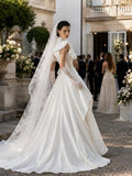 Load image into Gallery viewer, Ivory Statement Wedding Dress with Flowing Skirt and Refined Bridal Silhouette