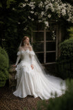 Load image into Gallery viewer, Ivory Wedding Gown with Graceful Full Length Silhouette and Dramatic Bridal Train