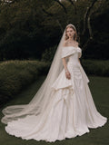 Load image into Gallery viewer, Ivory Statement Wedding Dress with Flowing Skirt and Refined Bridal Silhouette