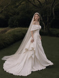 Load image into Gallery viewer, Ivory Statement Wedding Dress with Flowing Skirt and Refined Bridal Silhouette