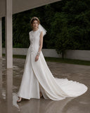 Load image into Gallery viewer, Ivory Statement Wedding Dress with Flowing Skirt and Refined Bridal Silhouette